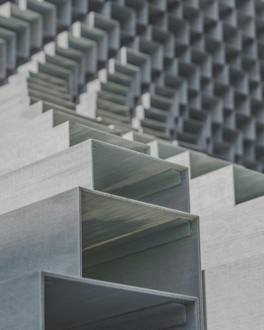 Close-up of abstract geometric metal structures with a minimalist and urban vibe.